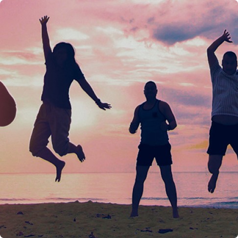 People jumping on the beach